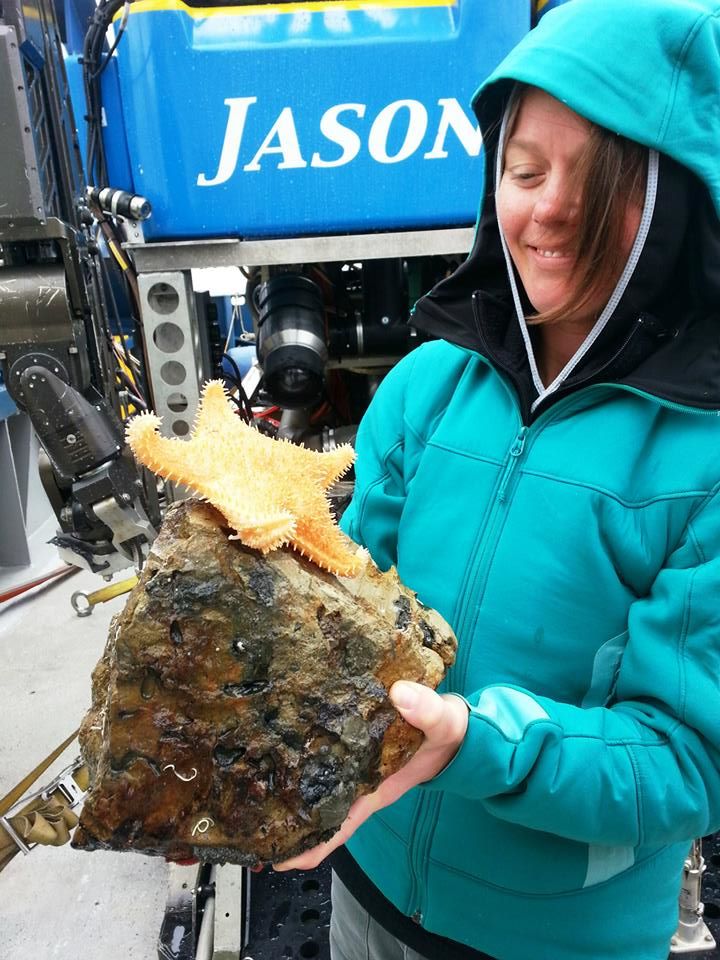 Figure 5. Samantha Bruce (Adjunct Instructor at College of Charleston) holding a starfish in front of ROV Jason.