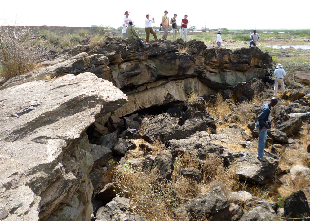 Figure 3. Field trip participants examine 'blister cave' in a welded tuff in the southern Afar.