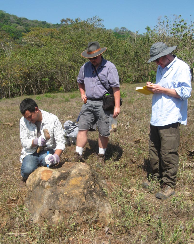 Figure 2.  The “Terrace Team” sampling radiolarian chert boulders for 10Be exposure age dating of late Pleistocene river terrace, Río Ora Valley. Left to right: Madhav Murari (U. Cincinati), Shawn Morrish (Cal Poly Pomona) & Lewis Owen (U. Cincinati).
